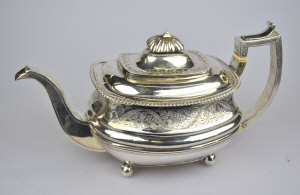 Appraisal: A George III silver teapot engraved band and reeded waist