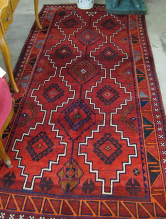 Appraisal: PERSIAN SHIRAZ CARPET overall geometric design on red ground hand