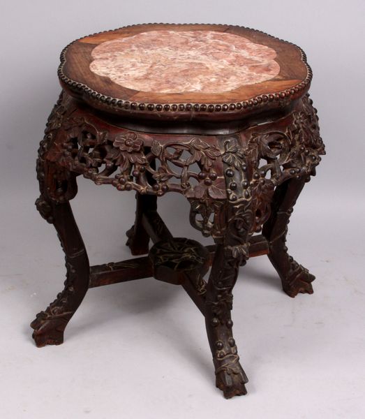 Appraisal: th Century heavily carved Chinese taboret stand with marble top