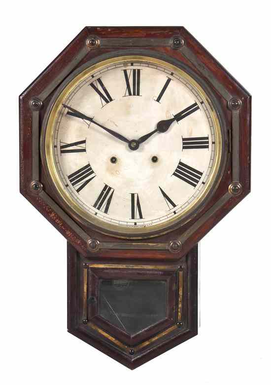 Appraisal: An American Wall Clock Waterbury the octagonal frame centered with