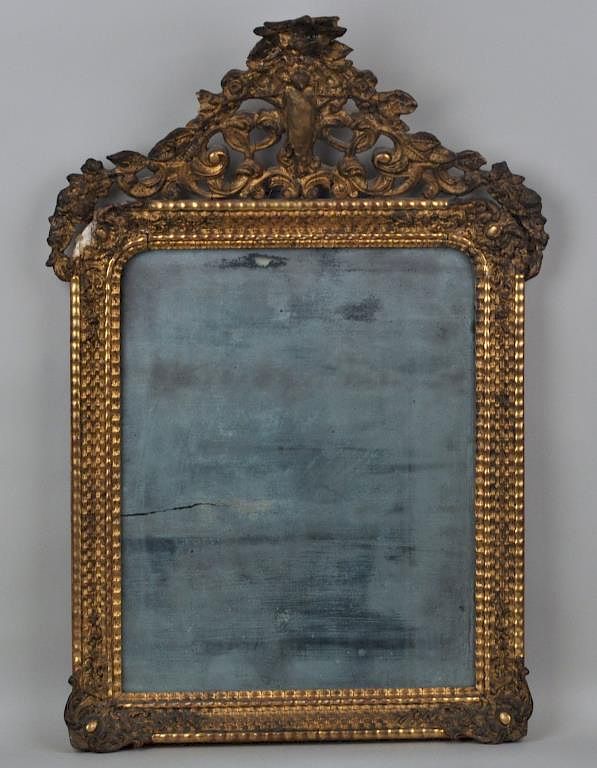 Appraisal: Early Continental Gilt Mirror having an elaborate crest depicting a