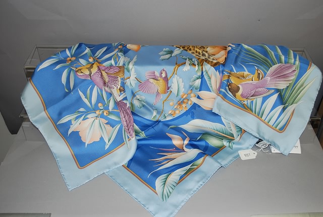 Appraisal: Salvatore Ferragamo blue silk scarf with sleeping leopard and bird