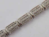 Appraisal: A white metal tests carat gold diamond bracelet grams approx