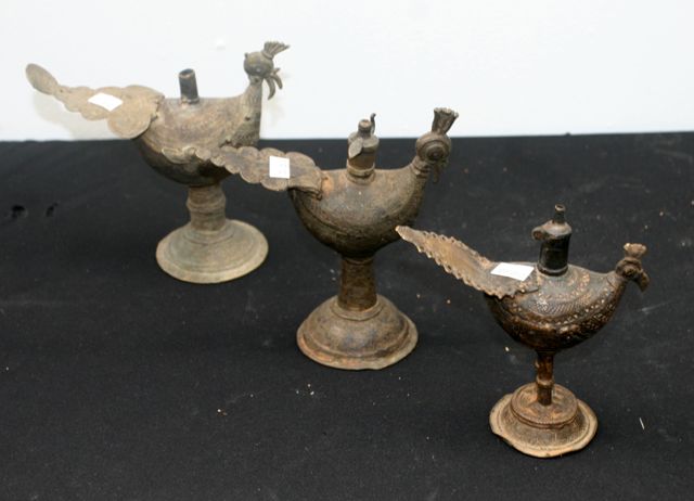 Appraisal: Three cast brass Dokra tribal oil lamps cast as birds