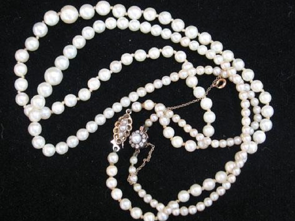 Appraisal: A GRADUATED STRING OF CULTURED PEARLS with pearl and diamond