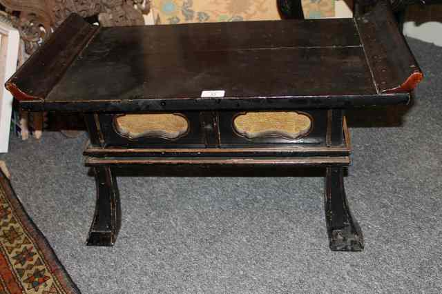 Appraisal: A JAPANESE BLACK AND GOLD LACQUER LOW TABLE fitted one