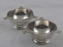 Appraisal: A pair of three handled silver salts with glass liners