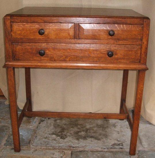 Appraisal: A Gordon Russell oak side table fitted one long and