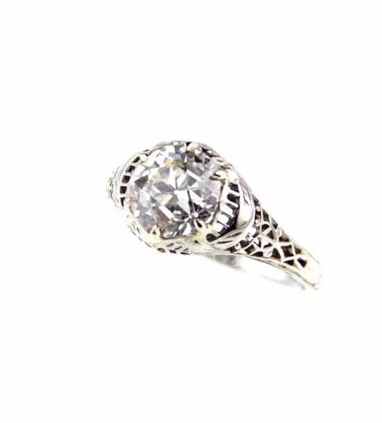 Appraisal: Art Deco diamond and filigree ring circa centered by round