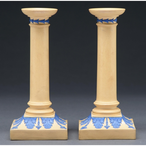 Appraisal: A pair of Wedgwood smear glazed drabware candlesticks c ornamented