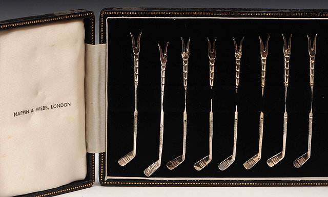 Appraisal: A SET OF EIGHT SILVER COCKTAIL STICKS in the form