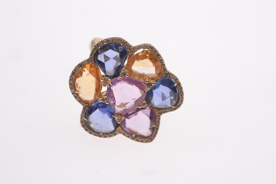 Appraisal: A FLORAL STYLE DRESS RING SET WITH MULTI COLOURED SAPPHIRED