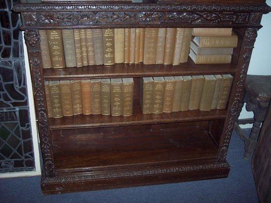 Appraisal: A carved oak bookcase fitted adjustable shelves cm wide