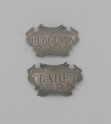 Appraisal: A pair of George II escutcheon labels with chased fruiting