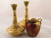 Appraisal: A pair of Japanese ceramic vases the cream glazed body