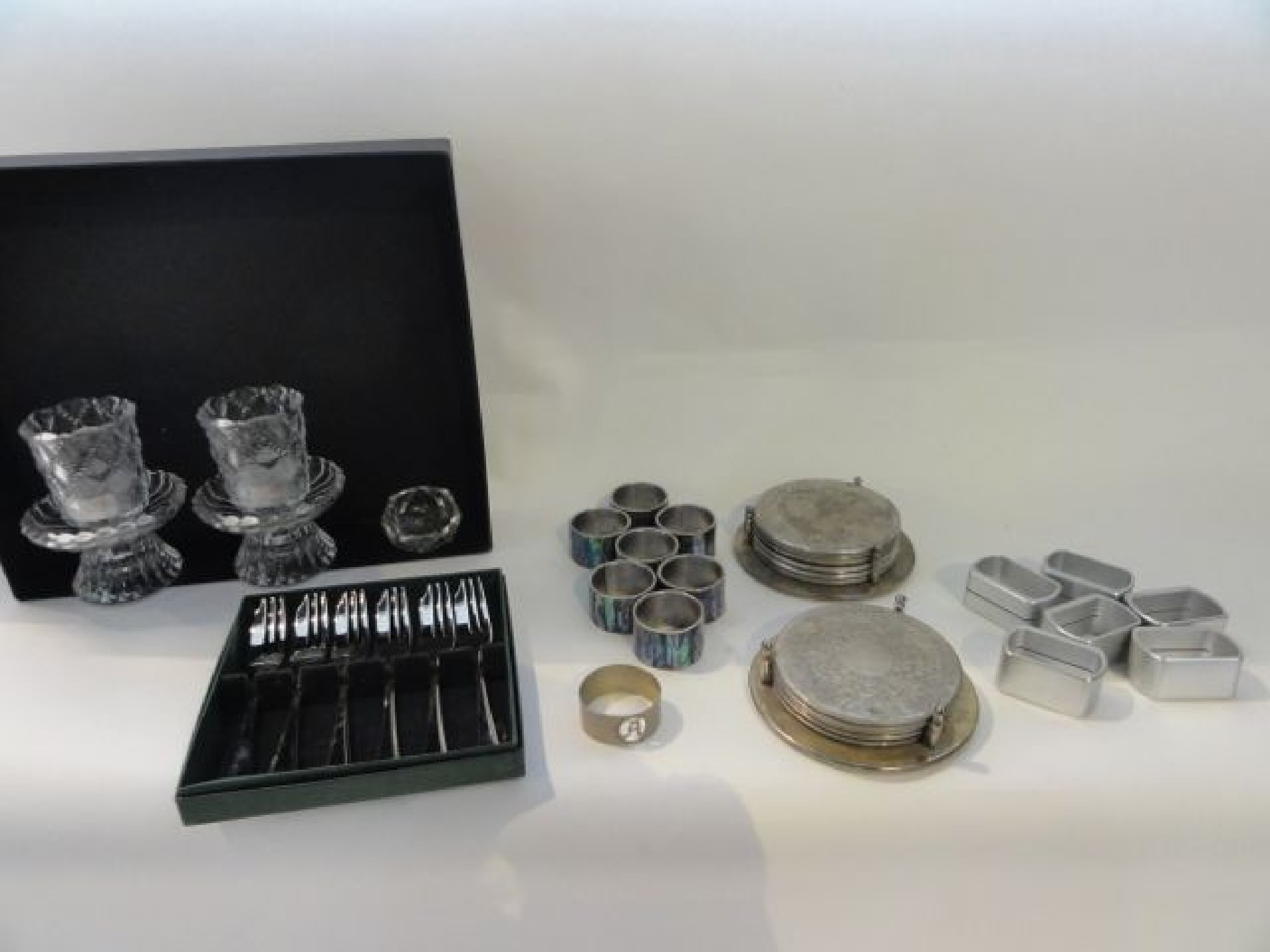 Appraisal: A selection of various napkin rings silver plated coasters cased