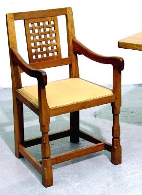 Appraisal: A SET OF FOUR ADZED OAK ELBOW CHAIRS by Robert