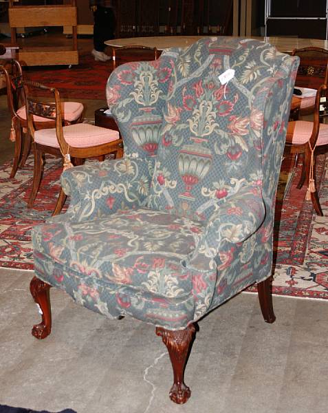 Appraisal: A George III style walnut upholstered wingchair th century height