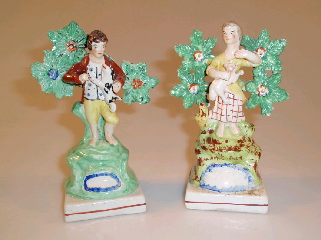 Appraisal: A pair of early thC square base Walton figure groups