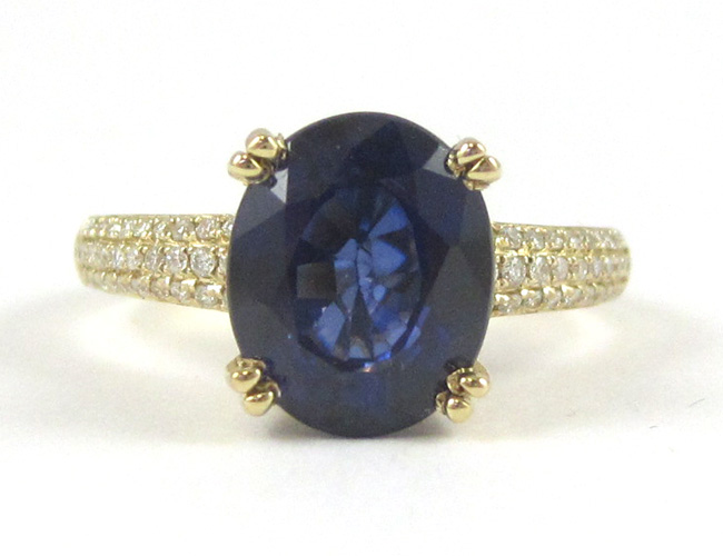 Appraisal: SAPPHIRE DIAMOND AND FOURTEEN KARAT GOLD RING with round-cut diamonds