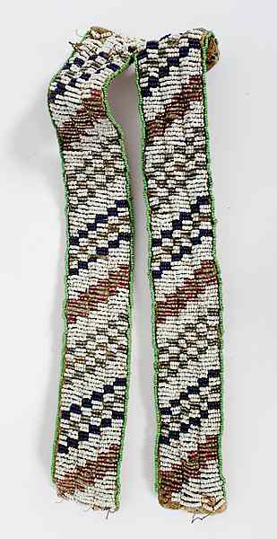 Appraisal: Sioux Beaded Hide Arm Bands sinew-sewn and beaded on buffalo