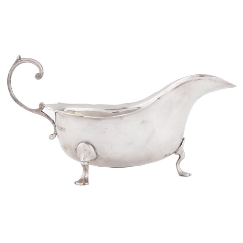 Appraisal: A George V silver sauceboat with flying scroll handle cm