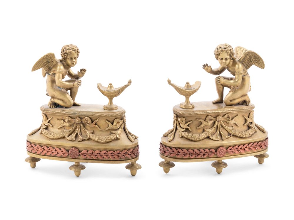 Appraisal: A Pair of Louis XV Style Patinated Bronze Figural Chenets