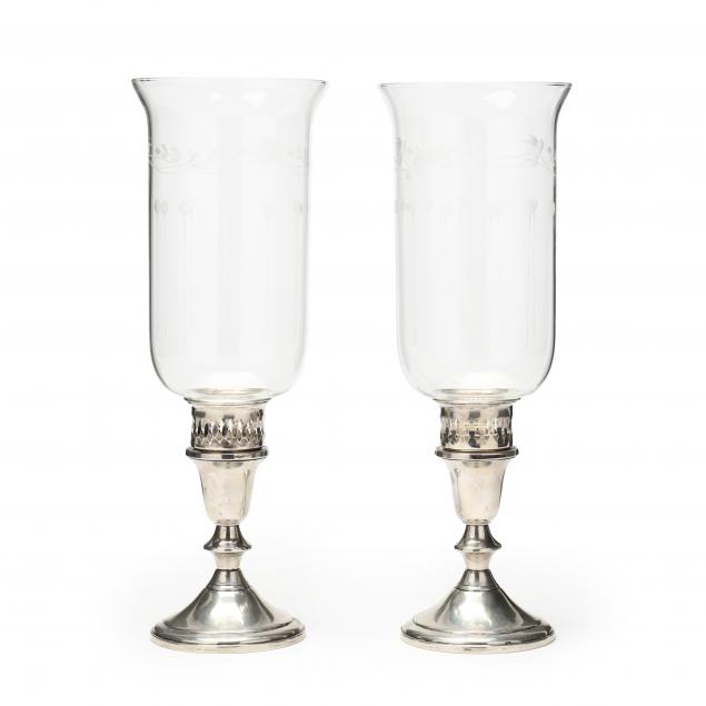 Appraisal: A Pair of Sterling Silver Candlesticks with Glass Hurricane Shades