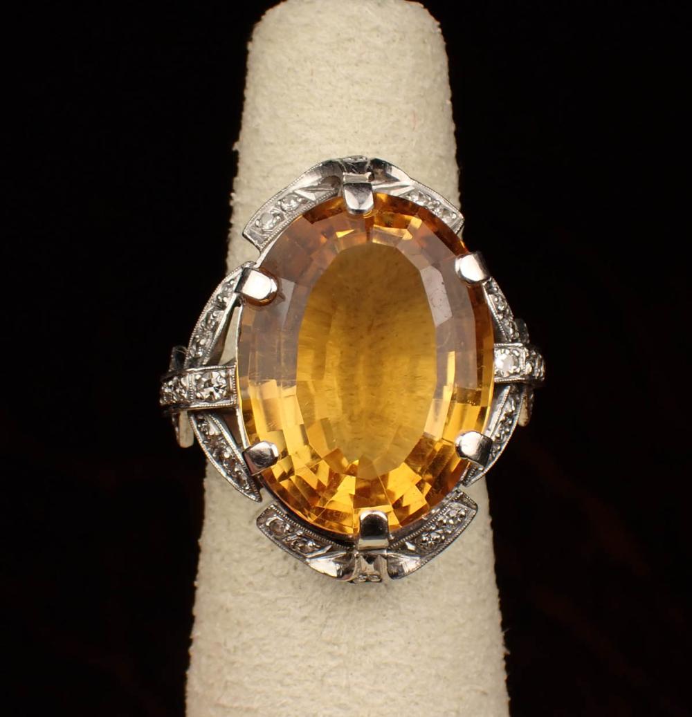 Appraisal: CITRINE DIAMOND AND PLATINUM RING with round single-cut diamonds set