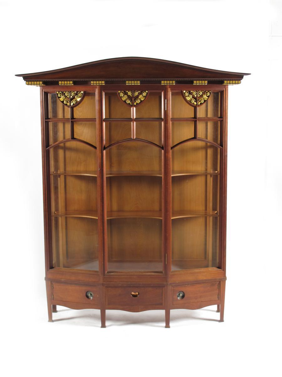 Appraisal: A mahogany display cabinet designed by George Walton