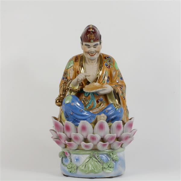 Appraisal: Chinese porcelain male figure seated on a lotus blossom Marked