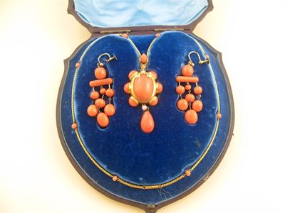 Appraisal: A th century coral set pendant with chain and earrings