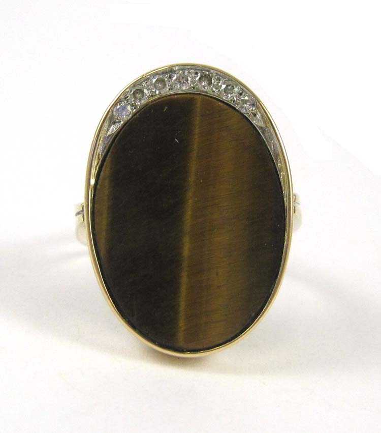 Appraisal: TIGER'S EYE DIAMOND AND FOURTEEN KARAT GOLD RING set with