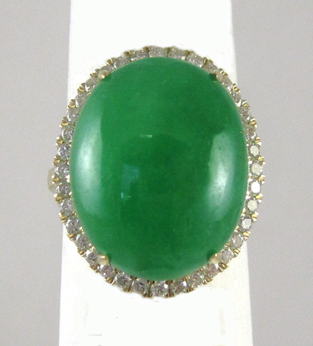 Appraisal: JADE DIAMOND AND FOURTEEN KARAT GOLD RING with round-cut diamonds