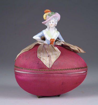 Appraisal: PINCUSHION EGG CANDY CONTAINER A German s pincushion affixed atop