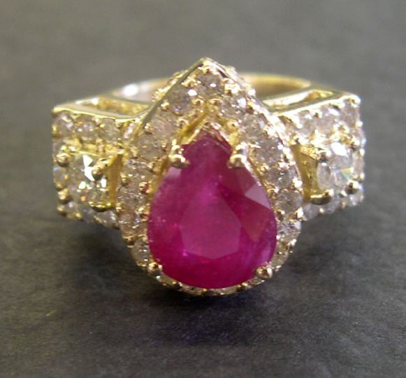 Appraisal: Fourteen-Karat Yellow Gold Ruby and Diamond Diner Ring containing one