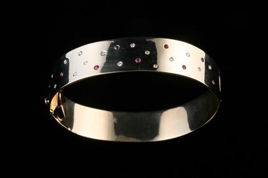 Appraisal: K YELLOW GOLD RUBY AND DIAMOND BRACELET Sixteen round diamonds