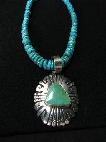 Appraisal: A Tommy Singer singed sterling silver Navajo pendant with Kingman