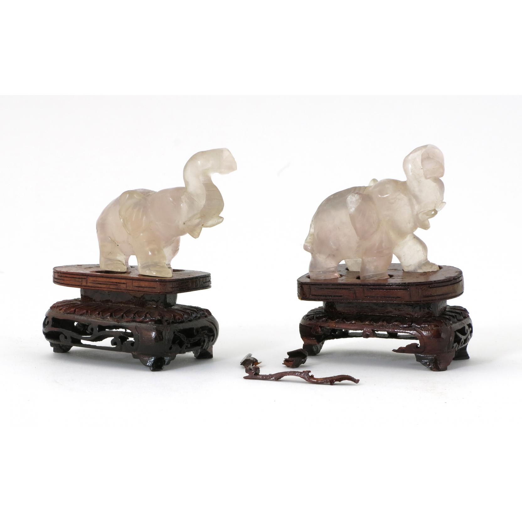 Appraisal: Pair of Crystal Quartz Elephants each shown with trunk raised