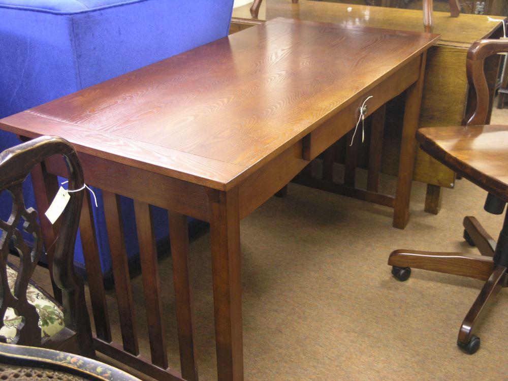 Appraisal: A modern dark stained oak office desk fall front to