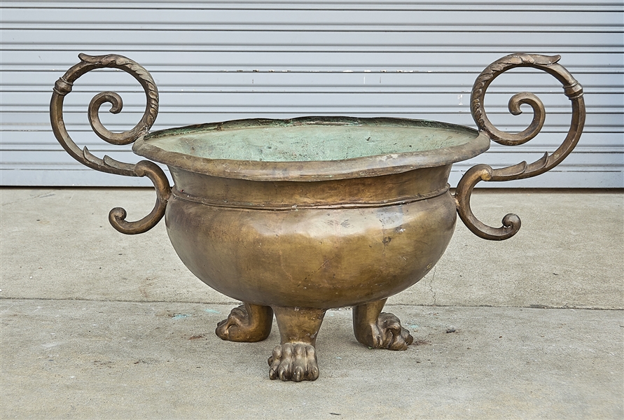 Appraisal: Large bronze tripod vessel animal paw-form feet scrolling handles x