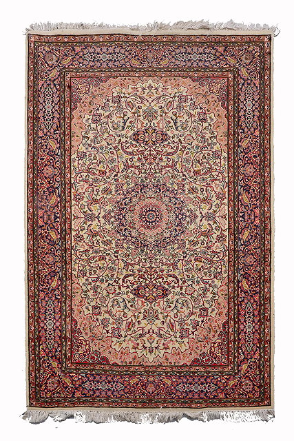 Appraisal: AN INDIAN PERSIAN PATTERN WHITE GROUND RUG with a complex