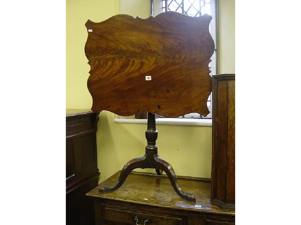 Appraisal: A Georgian mahogany snap-top table of rectangular form with shaped