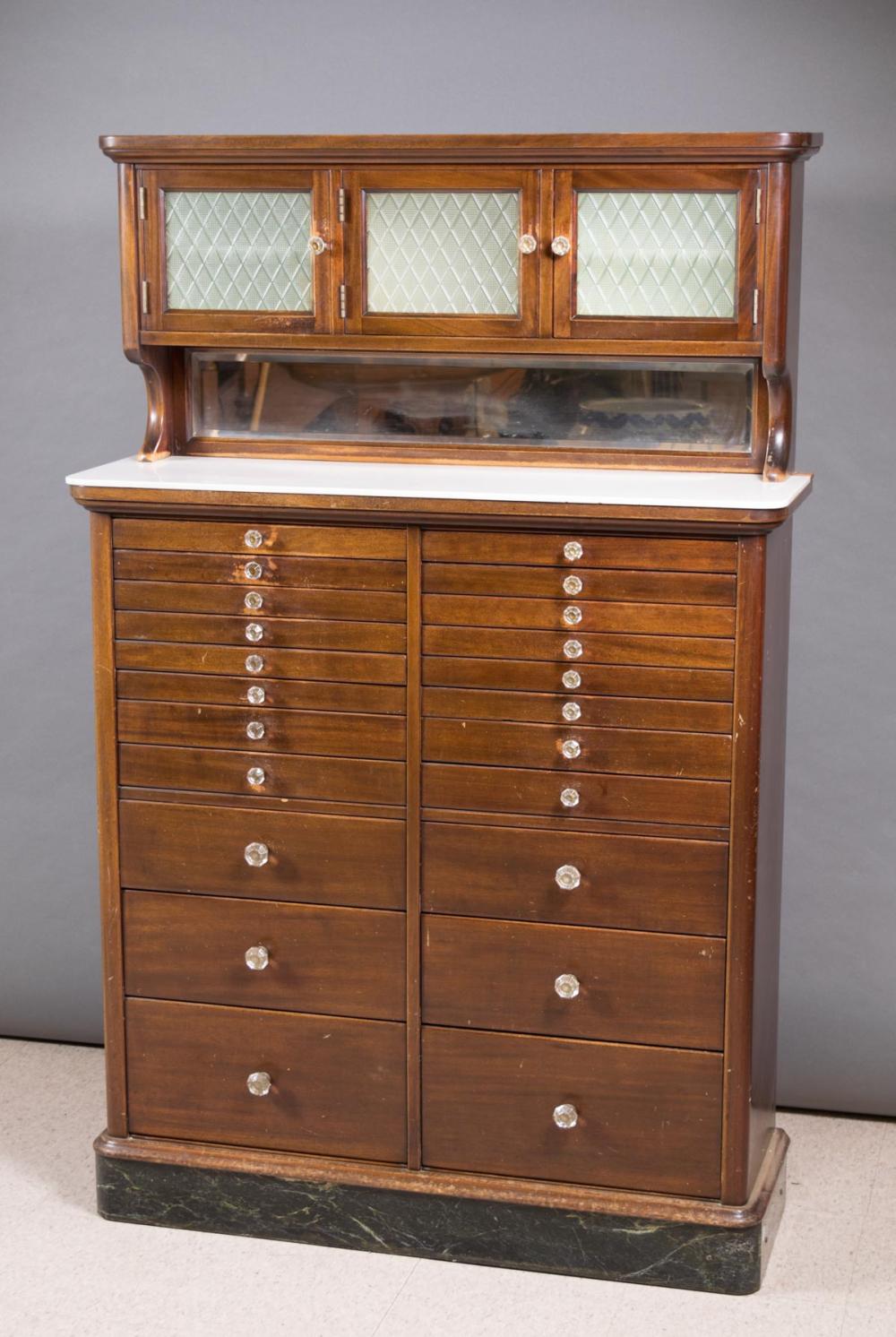 Appraisal: A TWENTY-TWO DRAWER MAHOGANY DENTAL CABINET WITH CONTENTS American early