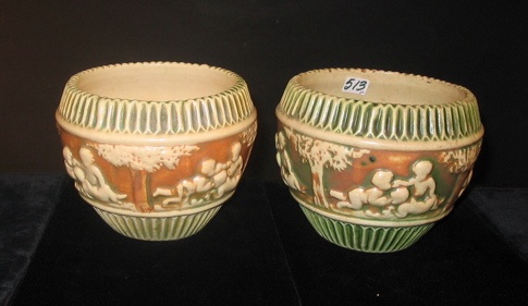 Appraisal: PAIR OF ROSEVILLE DONATELLO ART POTTERY PLANTER VASES with bands