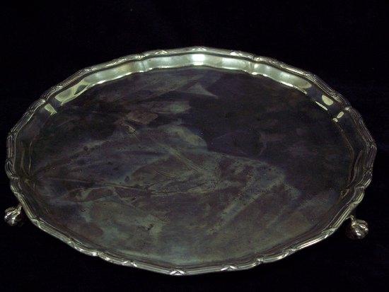 Appraisal: A salver the rim of thread and ribbon pattern raised