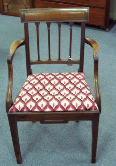 Appraisal: A George III mahogany armchair with four upright splats to