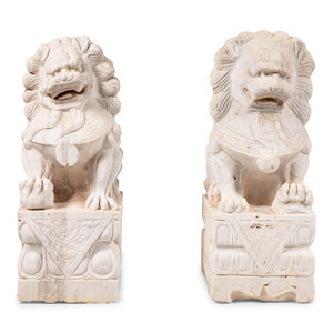 Appraisal: A Pair of Chinese Carved Marble Buddhistic Lions Late th