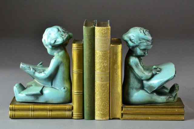 Appraisal: Pr Of Metal Bookends With Two Early th C BBookends