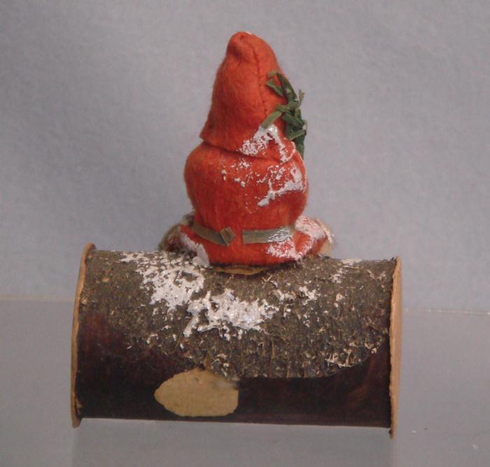 Appraisal: Paper mache and cardboard Santa candy container on log x